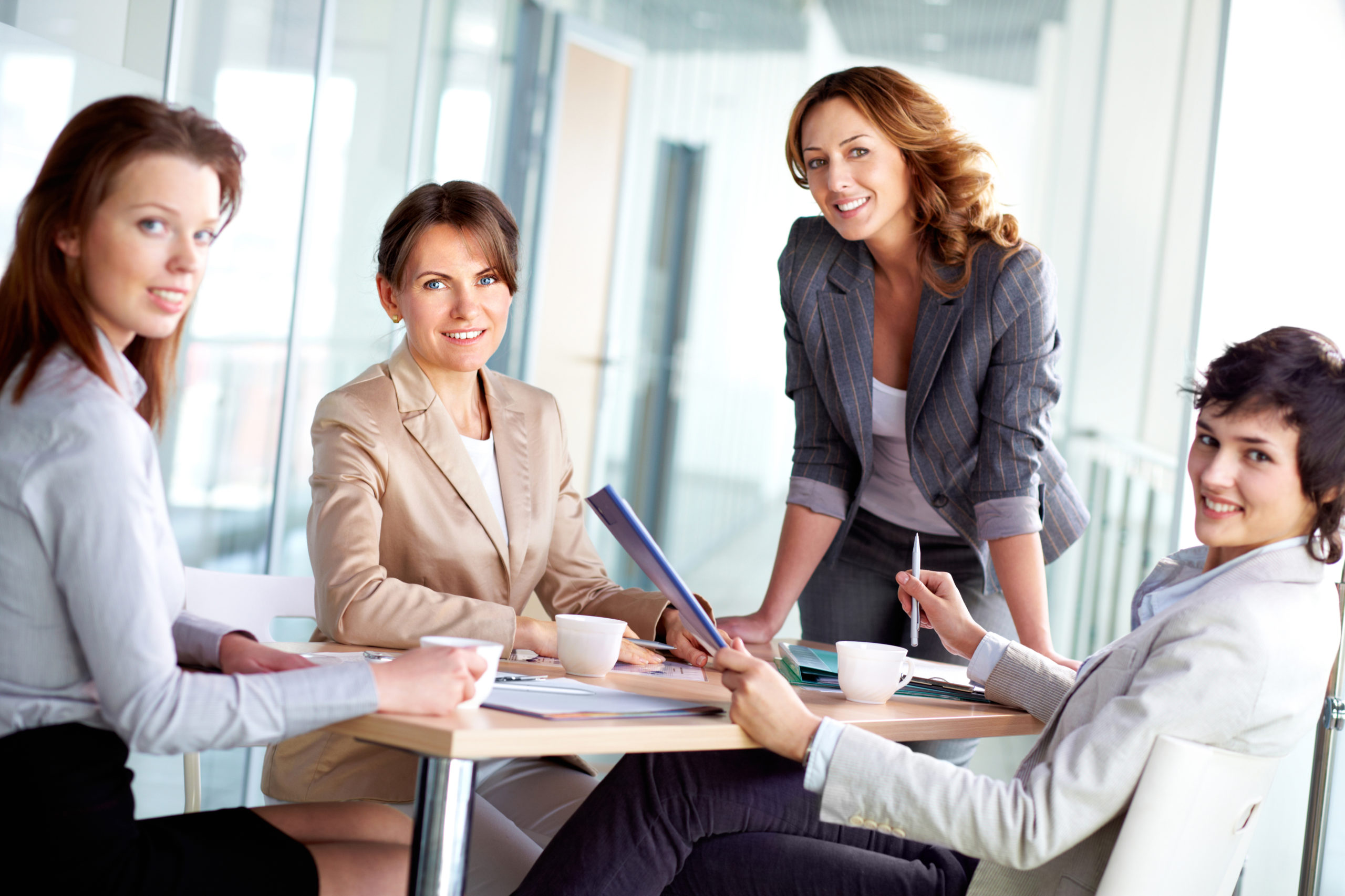 Image,Of,Four,Successful,Businesswomen,Looking,At,Camera,At,Meeting